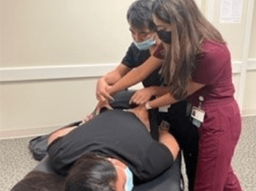 Checking lower back demonstration. 