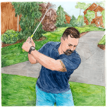 A man swings a golf club.