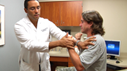 Doctor Okonkwo with a patient