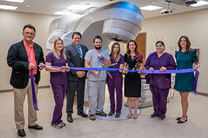 Standing from left, staff of UPMC Hillman Cancer Center in Central Pa., Dr. Eugene Fourkal, Alison Lawyer, Dr. David Weksberg, Ashley March, Cory Hoffman, Dr. Joella Wilson, Antonella Weaver, and Alexandra Chahwala at the ribbon cutting in Mechanicsburg on June 5.