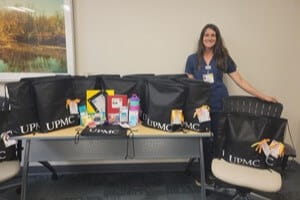 Demaree Koehler, RN, with the back-to-school bags prepped and ready to go home with each patient aged five- to 12 years-old scheduled for a wellness appointment at the UPMC Williamsport Family Medicine Residency office.
