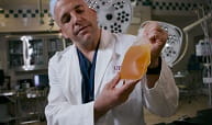 Jason Sperry, M.D., UPMC trauma surgeon, holds a bag of plasma. Credit: Tim Betler/UPMC.