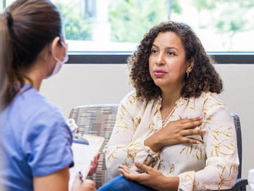 Patient discusses health with doctor