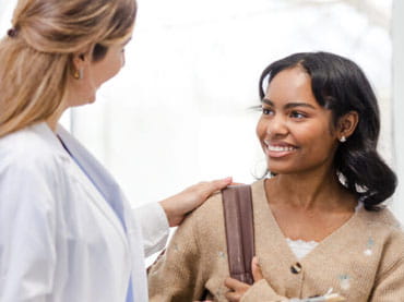 Woman talks to her doctor