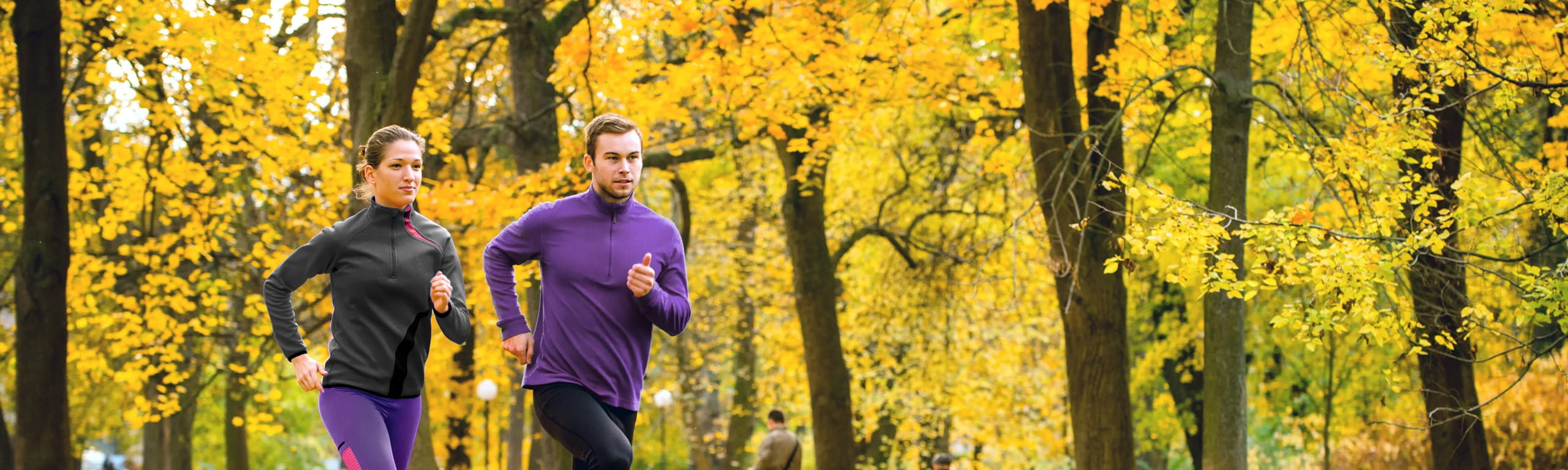 Image of a couple running outside.