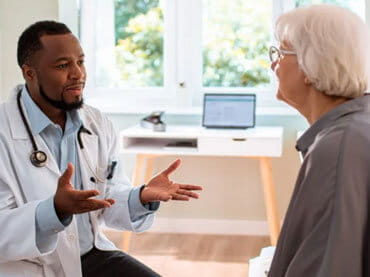 Doctor talking to patient