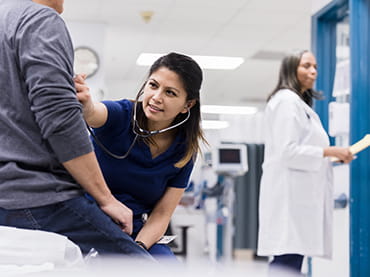 Emergency department doctor examining patient