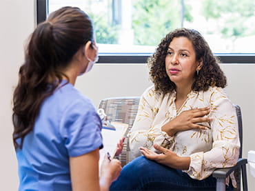 Urgent care doctor talking with patient