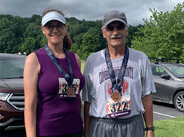 Karen and her Dad after her first 5K race June 2021.