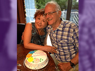 Image of Gene with his wife.