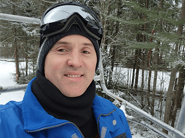 Image of Matt wearing ski mask on his head.